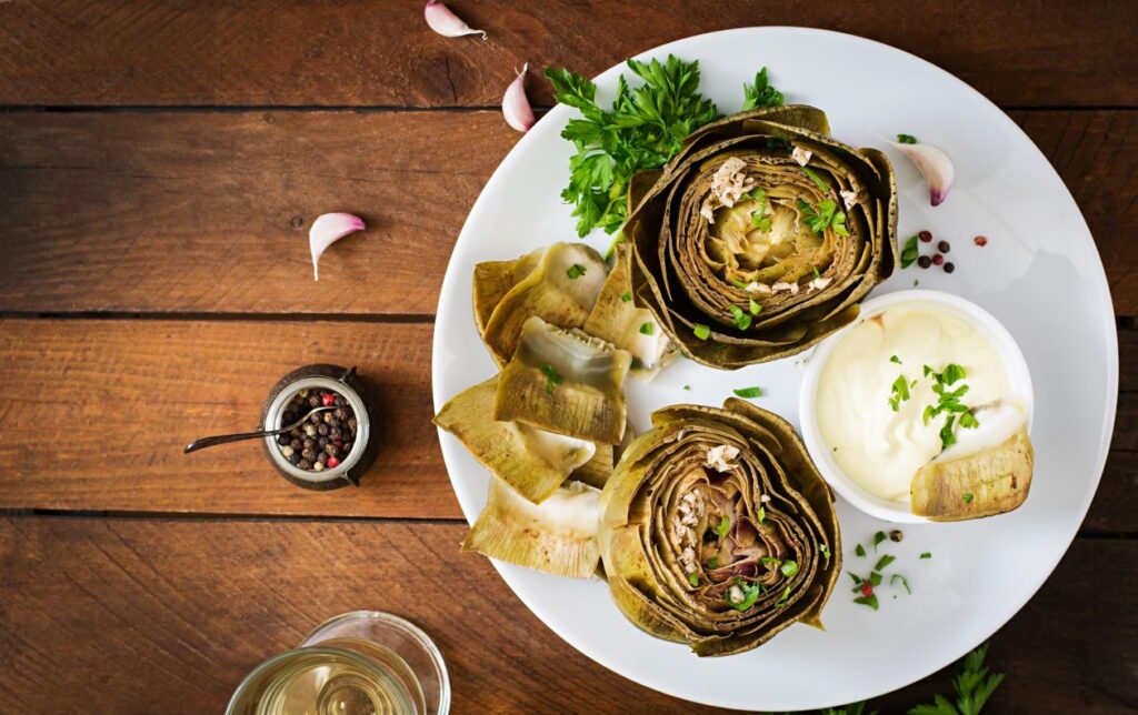 baked-artichokes-cooked-with-garlic-sauce-mustard-parsley-top-view