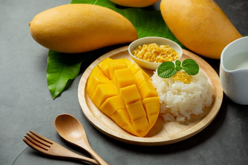 fresh-ripe-mango-sticky-rice-with-coconut-milk-dark-surface-1