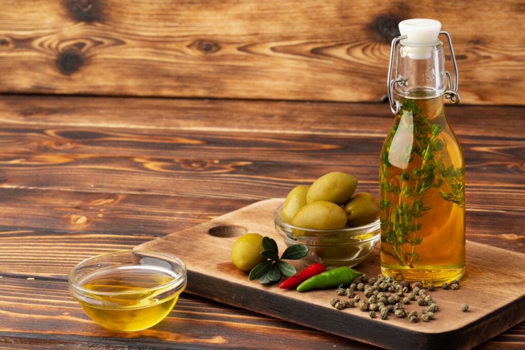 olives-bottle-olive-oil-wooden-background