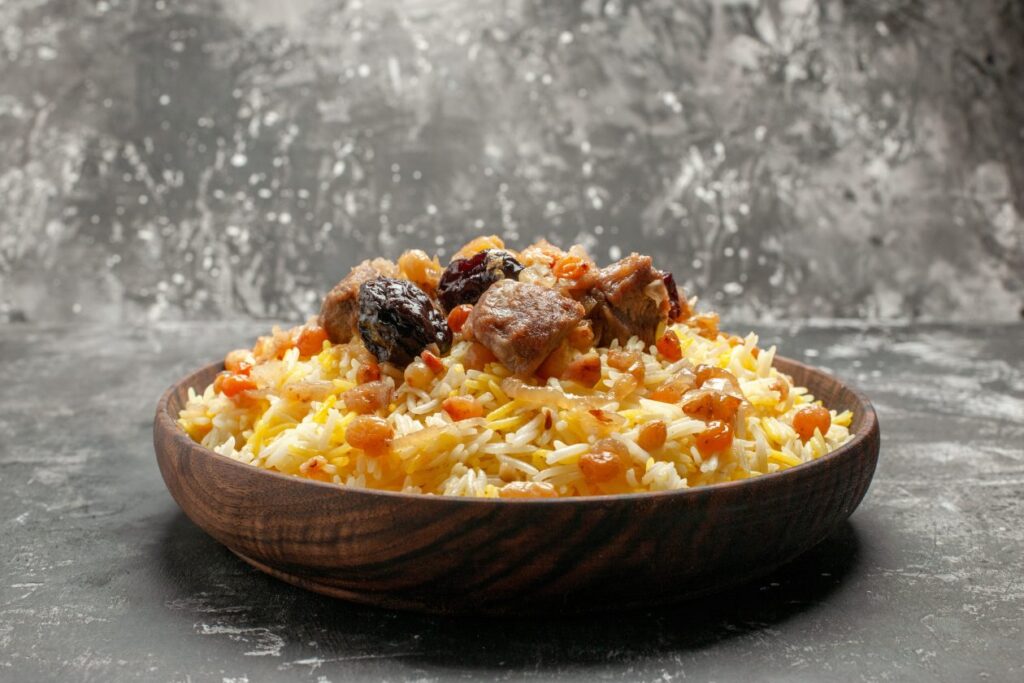 side-close-up-view-pilaf-appetizing-pilaf-with-rice-meat-dried-fruits