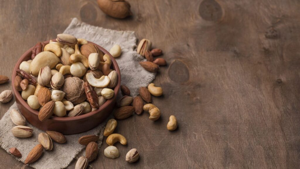 bowl-with-nuts-copy-space-wooden-background
