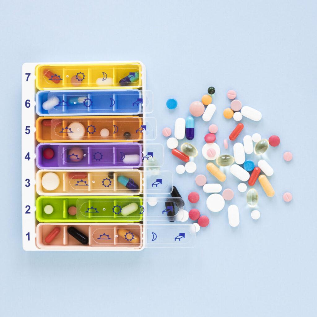 top-view-medicine-pillboxes-table